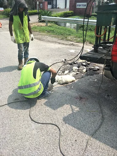 Polyurethane foam rising through cracks in a road pavement during injection